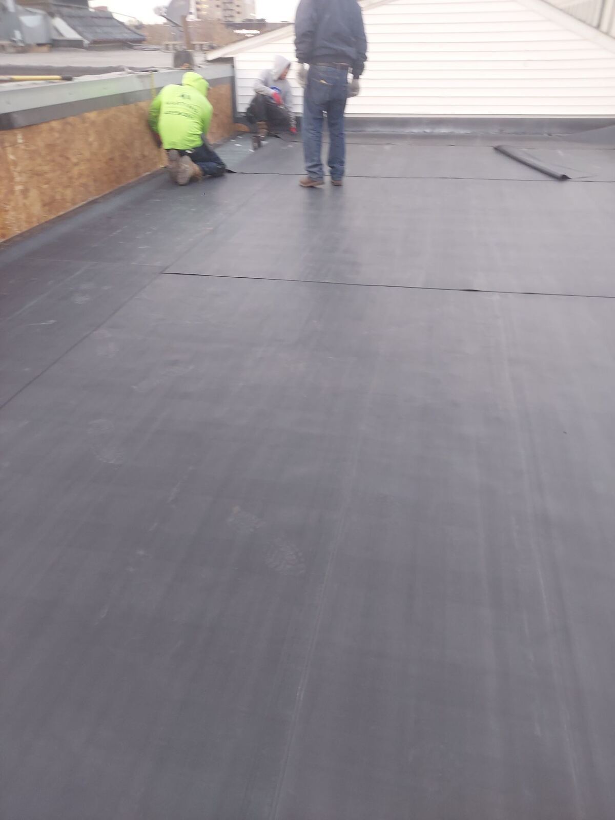 Commercial flat roof installation by Slusky Construction