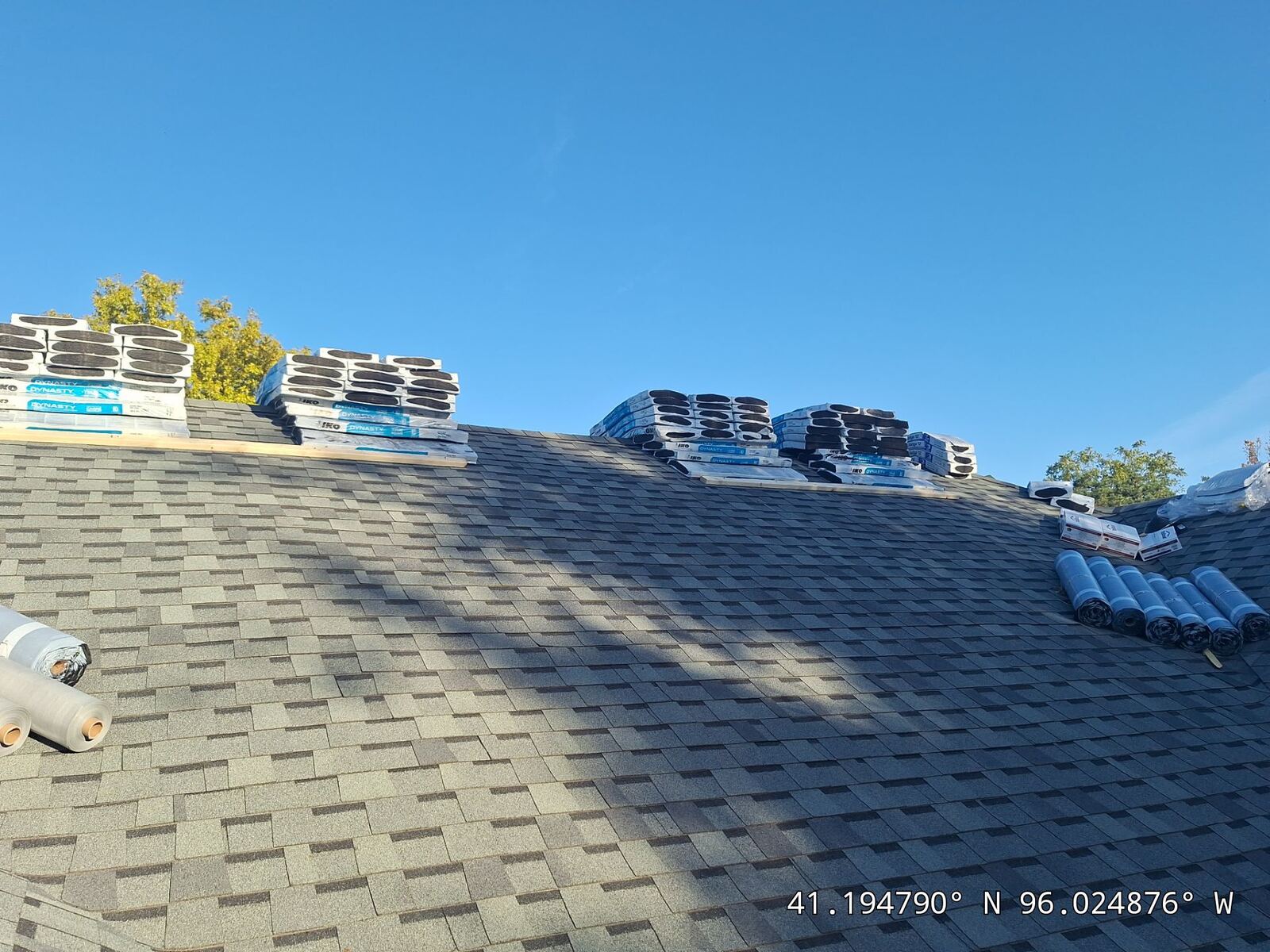 Dan Slusky in front of a completed roofing job in Omaha, NE